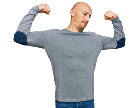 Bald man with beard wearing casual clothes showing arms muscles smiling proud. fitness concept.
