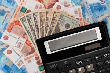 Economy financial concept, calculator on paper currency.