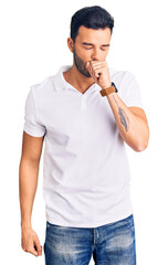 Young handsome hispanic man wearing casual clothes feeling unwell and coughing as symptom for cold...