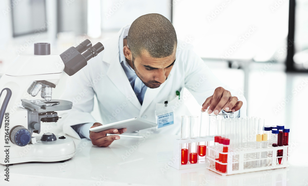 Poster he has good practical and technical skills. shot of a male scientist examining a test tube filled wi