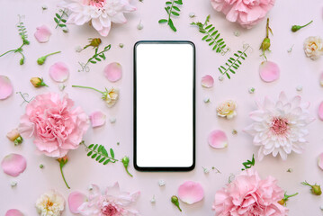 Fototapeta na wymiar Smartphone mock up screen on pink pastel flowers white floral feminine spring background. Mockup mobile phone blank empty display flower shop app florist delivery concept. Top view above, flat lay.