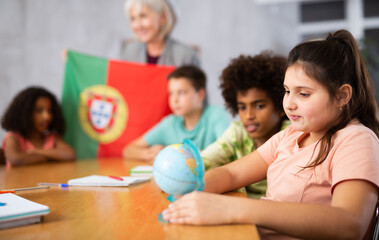 Kids learning together about portugal in geography class - obrazy, fototapety, plakaty