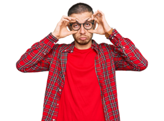 Hispanic young man wearing casual clothes trying to open eyes with fingers, sleepy and tired for morning fatigue