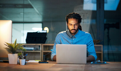 To stay productive you need to stay persistent. Cropped shot of a young designer working late on a...