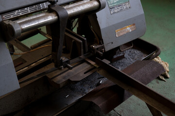 Work that cuts material with a saw
