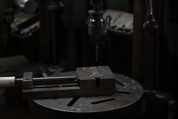 Fototapeta na wymiar Part machining with drilling machine