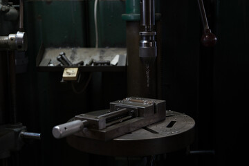Part machining with drilling machine