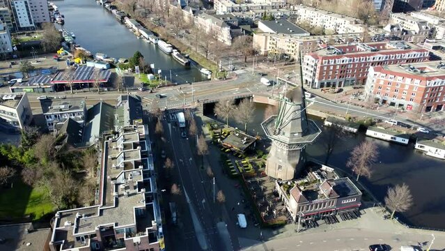 Amsterdam, Netherlands: drone view city 4K. Mill, Canals, Bridges, Dutch Buildings 2023