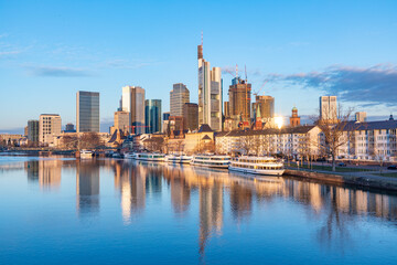 scenic view to skyline of Frankfurt am Main with reflection of the skyline in river Main. - obrazy, fototapety, plakaty