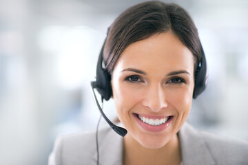 She goes the extra mile for her clients. Shot of an attractive customer support agent.