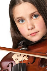 A young child with classical musical instrument violin