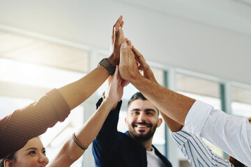 Theres nothing greater than being a part of a team. Cropped shot of a group of businesspeople high...