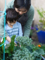 Mother and son tending the garden 