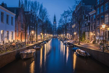 Fototapeten Evening panoramic view of the famous historic center with lights, bridges, canals and traditional Dutch houses in Amsterdam, Netherlands © Sen
