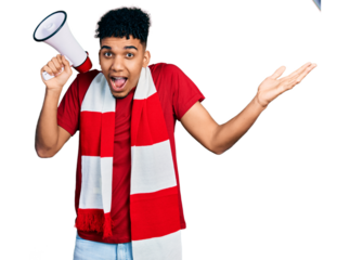 Young african american man football hooligan holding megaphone celebrating victory with happy smile and winner expression with raised hands