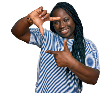 Young black woman with braids wearing casual clothes smiling making frame with hands and fingers with happy face. creativity and photography concept. - Powered by Adobe