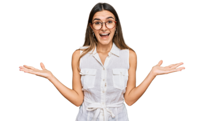 Young hispanic woman wearing casual clothes celebrating victory with happy smile and winner expression with raised hands