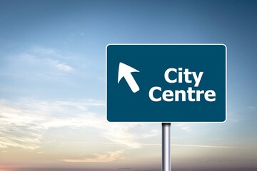 Road sign of city center on sky background