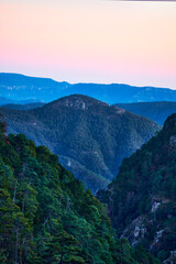 sunset in mountains with sky of colors and blue mountains, sierra madre occidental in mexiquillo durango 