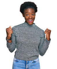 Young african american girl wearing casual clothes celebrating surprised and amazed for success...
