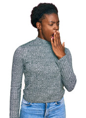 Young african american girl wearing casual clothes bored yawning tired covering mouth with hand. restless and sleepiness.