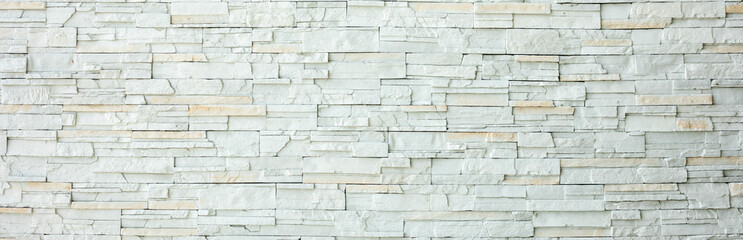 White brick wall as a background or texture, horizontal shape with space for design. Web banner. Wide. Panoramic. Website header