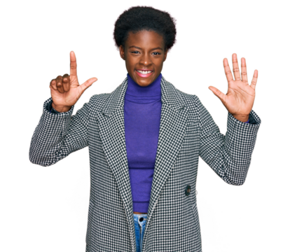 Young african american girl wearing casual clothes showing and pointing up with fingers number seven while smiling confident and happy.
