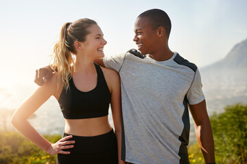 Naklejka premium I can always count on you to keep me motivated. Shot of a fit young couple working out together outdoors.