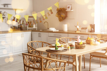 Festive table setting for Easter dinner in kitchen