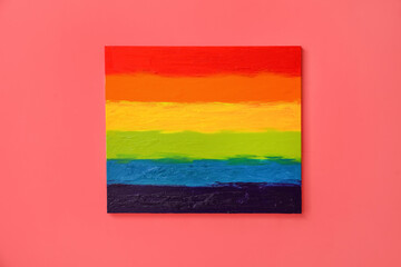 Painting of LGBT flag on color wall