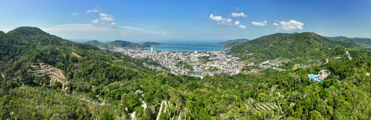 Fototapeta na wymiar Phuket Thailand patong bay. Panorama landscape nature view from Drone camera. Aerial view of patong city in phuket thailand. Beautiful sea in summer sunny day time