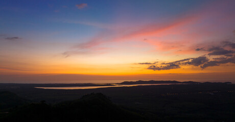 Fototapeta na wymiar Aerial view beautiful sunset or sunrise light dramatic sky over mountain landscape