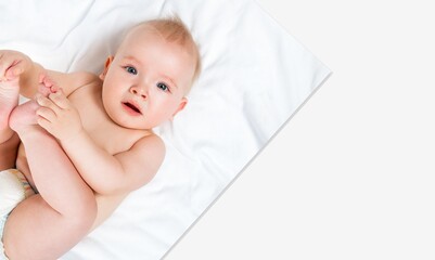 A small cute baby smile on bed