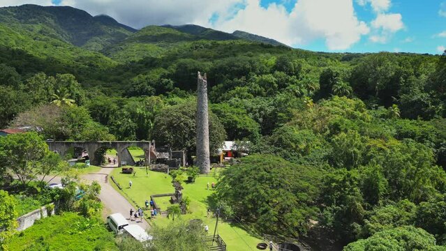 Flying past the old rum distillery on St Kitts island, over the jungle up Mount Liamuiga, the island's great volcano.