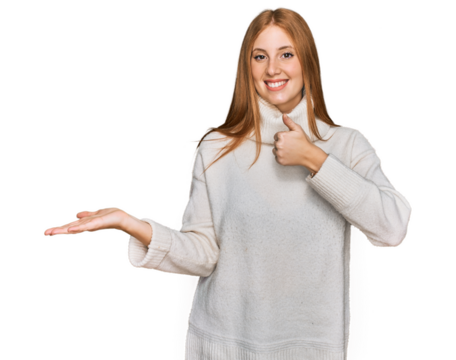 Young irish woman wearing casual winter sweater showing palm hand and doing ok gesture with thumbs up, smiling happy and cheerful