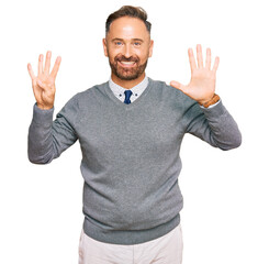 Handsome middle age man wearing business clothes showing and pointing up with fingers number nine while smiling confident and happy.
