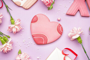 Composition with sweet cookies and beautiful carnation flowers on lilac background. Valentine's Day celebration