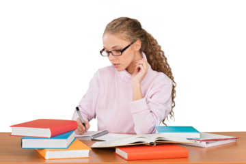 Girl Sitting Behind a Desk with a Books and Writing in Note Pad - Isolated