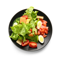 Plate of delicious salad with boiled eggs and salmon isolated on white background