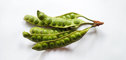 Raw of petai or pete (Parkia speciosa). Usually eaten raw and cooked, popular with name stink bean or bitter bean. Pete plants grow a lot in Indonesia. Indonesia use petai for fresh vegetable, dishes.