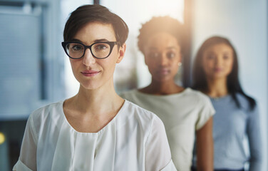 Their team commitment is without limitation. Cropped shot of a group of businesspeople standing in...