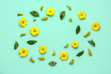 Obraz premium Frame made of yellow flowers and plant leaves on color background