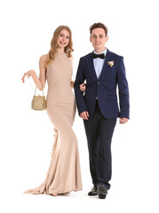 Beautiful couple dressed for prom on white background © Pixel-Shot
