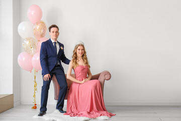 Beautiful couple dressed for prom in room