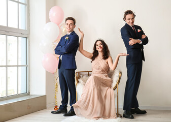 Teenage boys and girl dressed for prom in room © Pixel-Shot