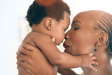 Happy, touch and nose with mother and baby for bonding, affectionate and connection in family home. Kindness, happiness and smile with black woman holding child for positive, growth and support