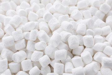 Fototapeta na wymiar Many delicious sweet marshmallows as background, closeup