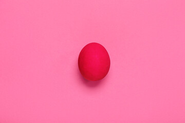 Painted Easter egg on pink background