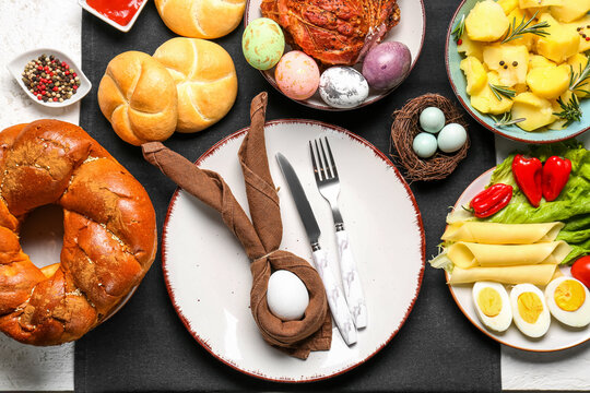 Easter table setting with tasty dishes, closeup