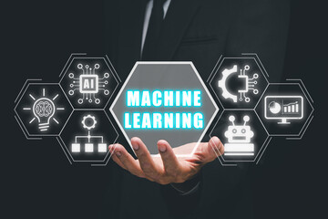 Machine learning concept, Businessman hand holding machine learning icon on virtual screen.